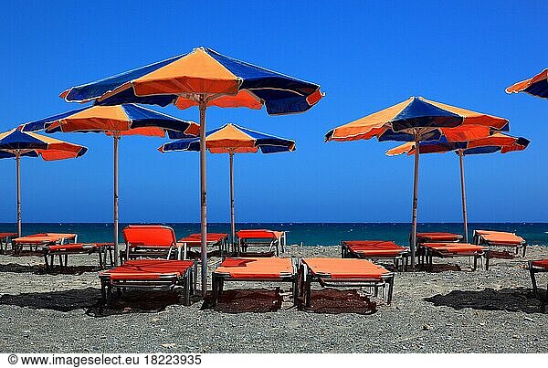 Beach chairs and umbrellas on the beach  Crete  Greece  Europe