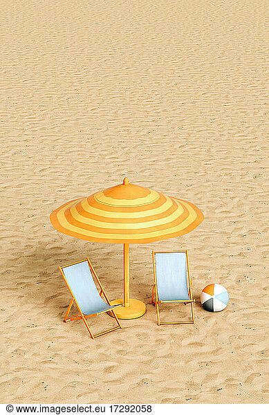 Beach umbrella  two empty deck chairs and beach ball on sandy beach