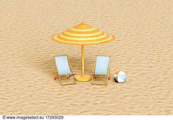 Beach umbrella  two empty deck chairs and beach ball on sandy beach