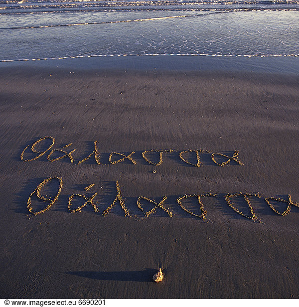 Beach With Greek Writing in the Sand