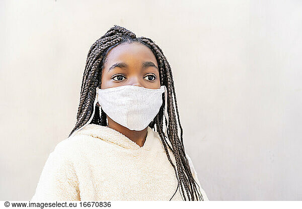 beautiful african girl posing with her mask