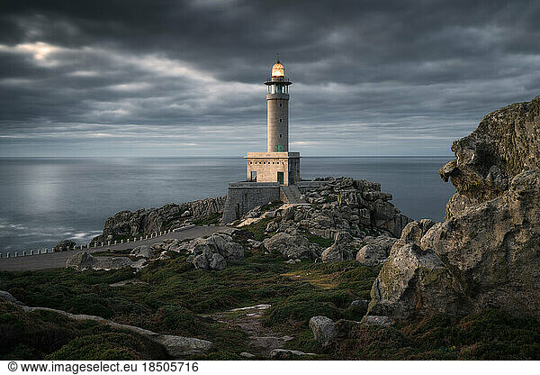 Beautiful blue hour in Punta Nariga lighthouse. Galicia  Spain.