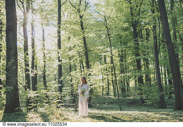 Beautiful bride in forest