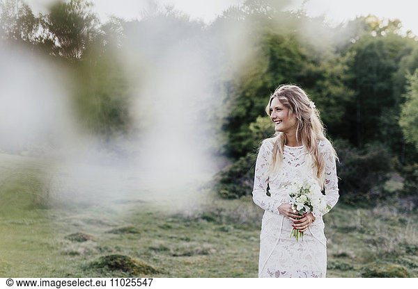 Beautiful bride in meadow
