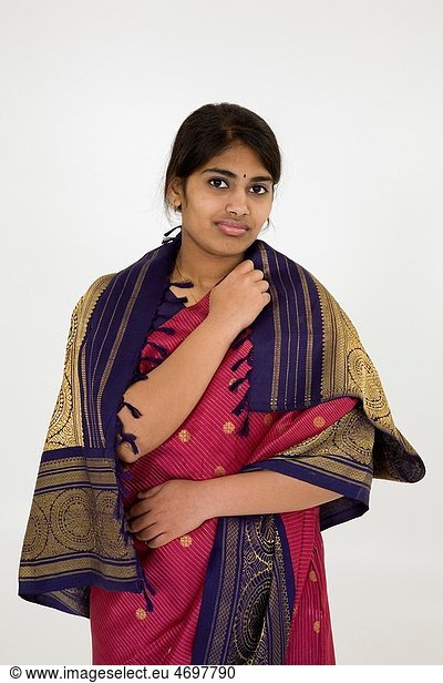 Beautiful Hindu teenager dressed in a traditional Sari dress