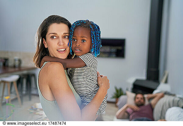 Beautiful mother and toddler daughter at home