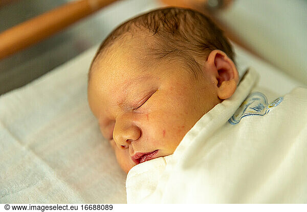 Beautiful newborn baby sleeping peacefully.