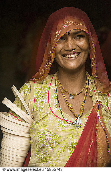 Beautiful Rajasthan woman wearing traditional clothes  smiles