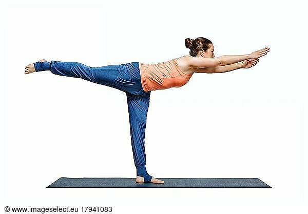 Beautiful sporty fit woman practices yoga asana Virabhadrasana 3  warrior 3 pose isolated on white