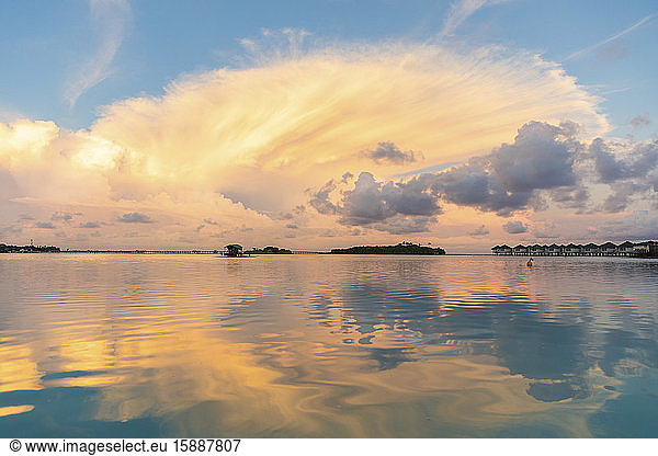 Beautiful sunset with clouds and reflections on the water  Male  Maldives