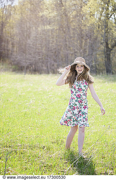 Beautiful Teen Girl Outdoors in Sundress  backlit.