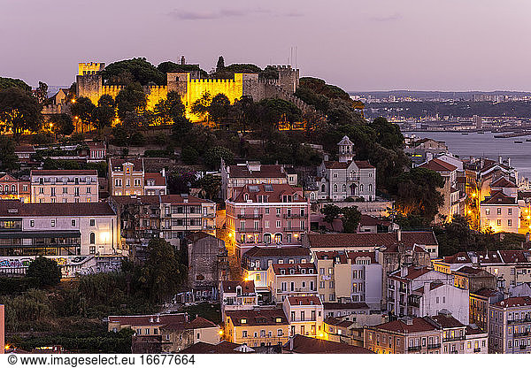 Beautiful view to old historic city buildings and castle during sunset