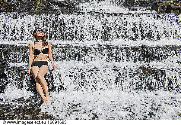 beautiful woman at the Pongour waterfall close to Da Lat in Vietnam