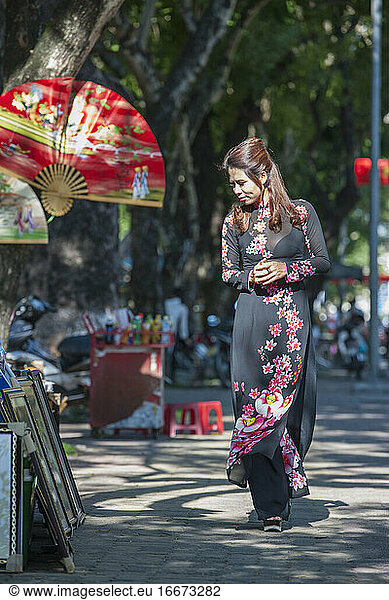 beautiful woman browsing street market market in Hue / Vietnam