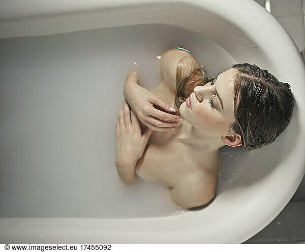 beautiful young woman in bathtub