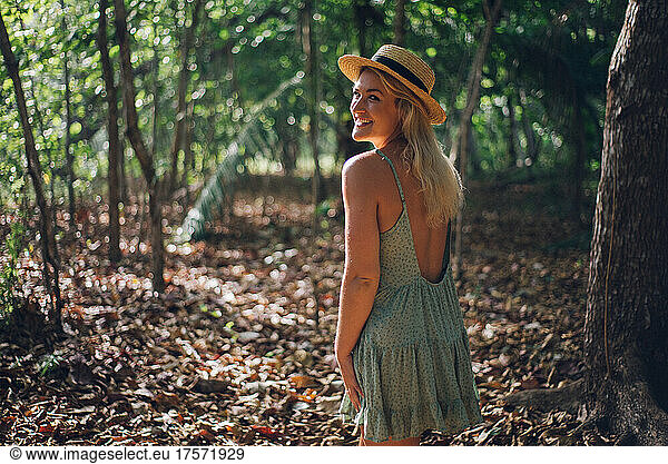 beauty portrait of a blond girl in the jungle