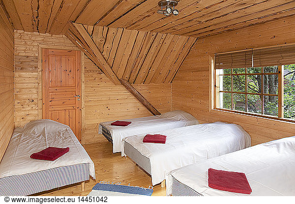 Beds in a Wooden Bedroom