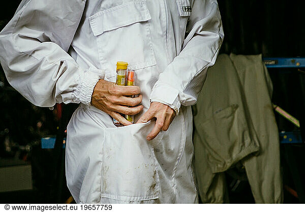 beekeeper preparing her epipen before inspecting the hives