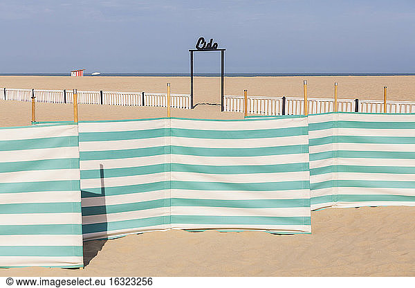Belgium  Flanders  Ostende  North sea seaside resort  windbreak  sign lido  empty beach