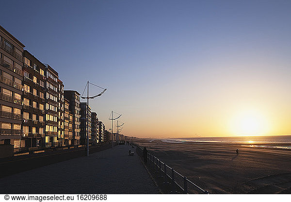 Belgium  Flanders  View of beach and building at sunset