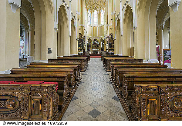 Benches in empty Church of the Assumption of Our Lady and Saint John the Baptist  Kutna Hora  Czech Republic