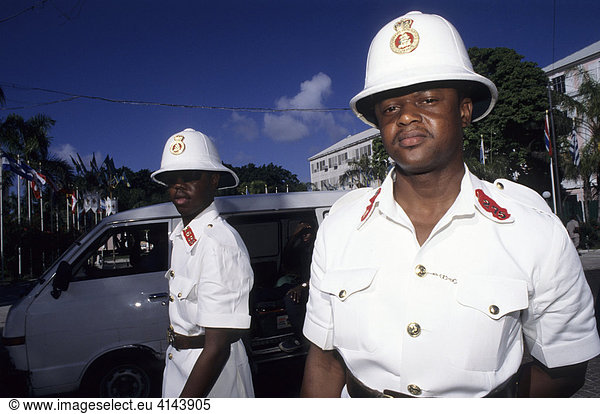 BHS  Bahamas  New Providence  Nassau: Female police officers on Bay street. Independent state in the West Indies  member of Comonwealth of Nations.