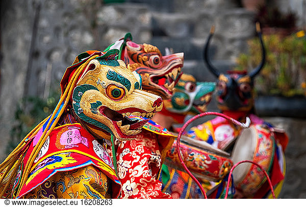 Bhutanese people performing the masked Cham Dance,  Paro,  Bhutan,  Asia