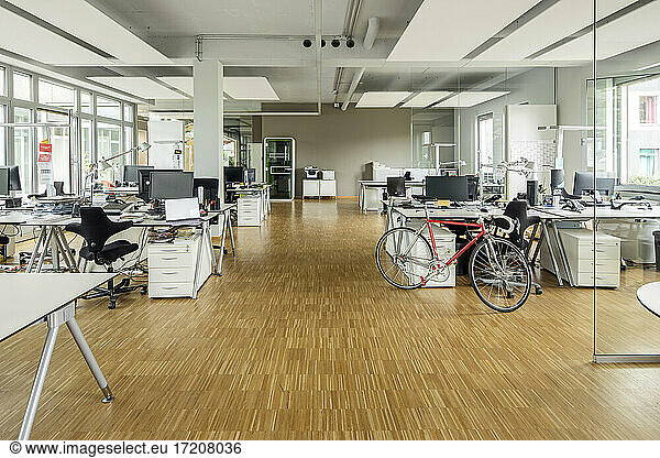 Bicycle at desk in office
