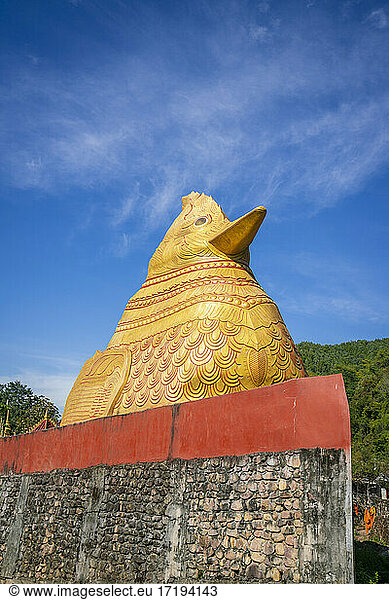 Big golden statue of chicken at Ko Yin Lay Monastery  Kengtung Myanmar
