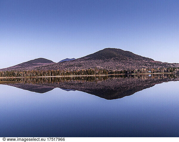 Bigelow Mountain mirrored in calm Flagstaff Lake  Maine