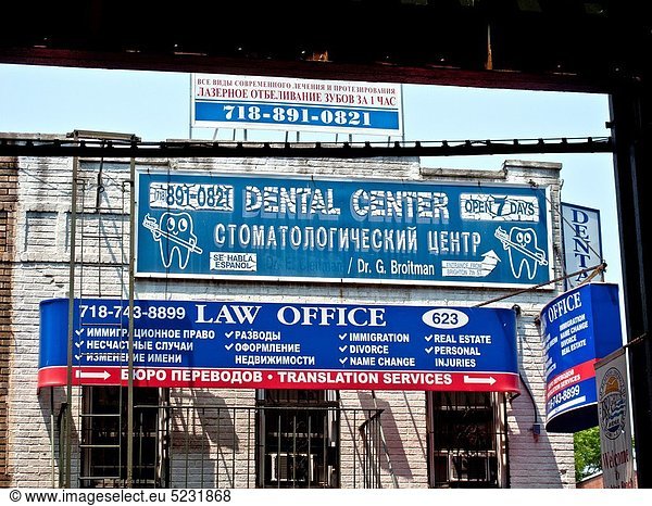 Bilingual business signs in English and Russian in the ´Little Odessa´ neighborhood of Brighton Beach in Brooklyn  New York The area is largely populated by Russian immigrants