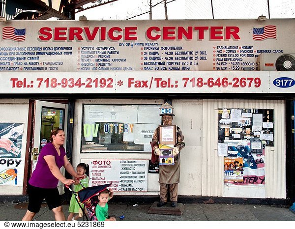 Bilingual business signs in English and Russian in the ´Little Odessa´ neighborhood of Brighton Beach in Brooklyn  New York The area is largely populated by Russian immigrants
