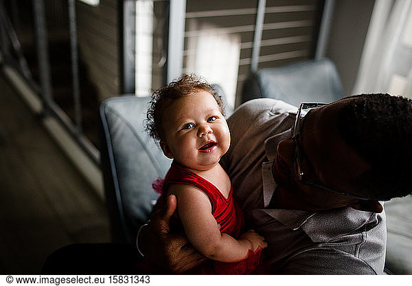 Biracial Baby Smiling for Camera as African American Dad Smiles