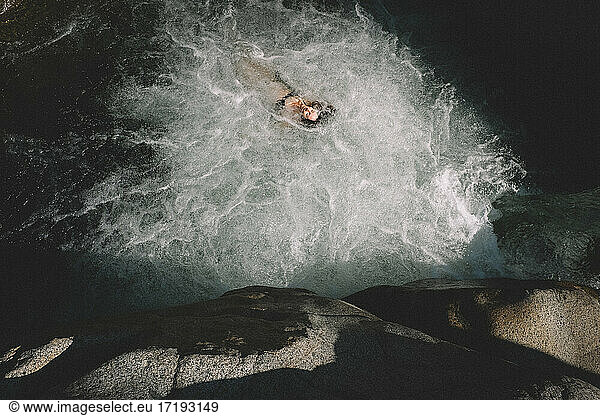 Bird's Eye View of Woman Floating in a Dreamy Pool of Bubbles