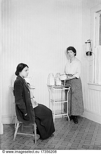 Birth Control activist Margaret Sanger (1879-1966) with Fania Mindell inside Birth Control Clinic  Brownsville  Brooklyn  New York  USA  Bain News Service  1916