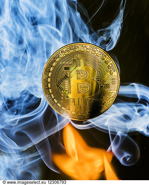 Bitcoin with flame and smoke