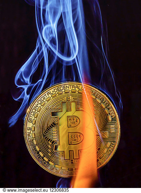 Bitcoin with flame and smoke