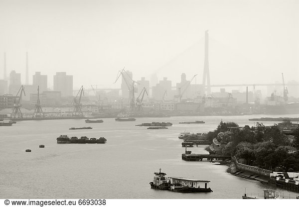 Black and White of Cranes and River Traffic