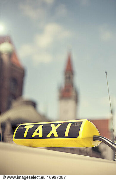 Black and yellow taxi sign