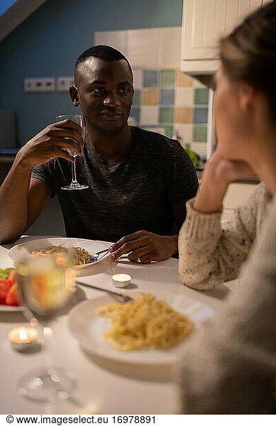 Black guy listening to girlfriend during date