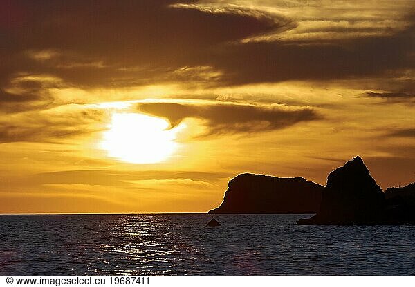 Black rocks  grey clouds  sunset  dusk  Marettimo  Egadi Islands  Sicily  Italy  Europe