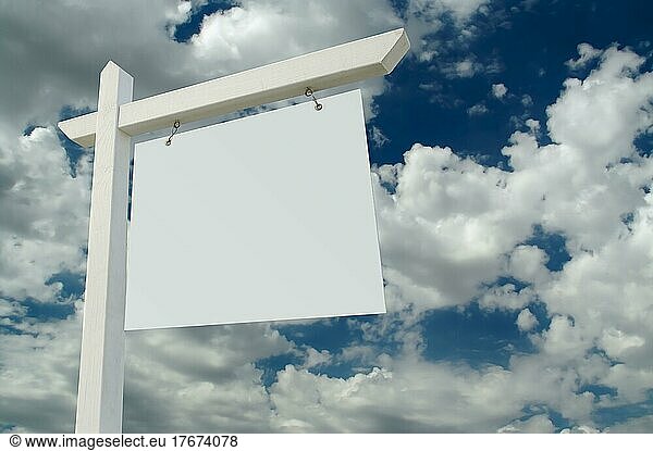 Blank real estate sign on clouds & sky background  ready for your own message