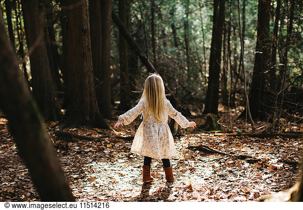 Blond haired girl in forest