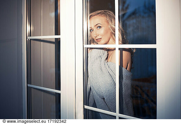 Blond woman behind the window