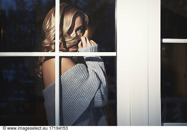 Blond woman behind the window