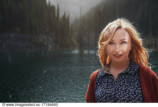 Blond woman exploring Kaindy Lake  Kazakhstan