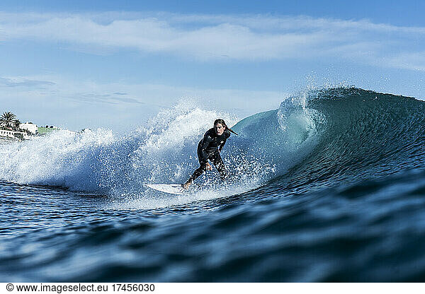 blonde surfer  on the wave  sea  blue