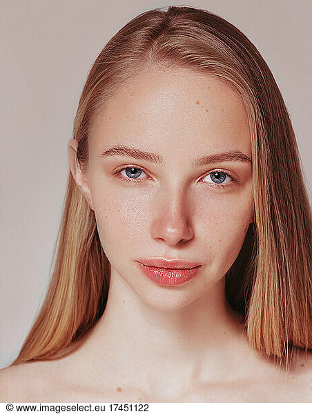 Blonde woman natural hair beauty closeup portrait