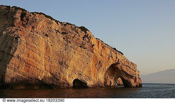 Blue Caves  morning light  rocky coast  blue cloudless sky  northeast coast  Zakynthos Island  Ionian Islands  Greece  Europe