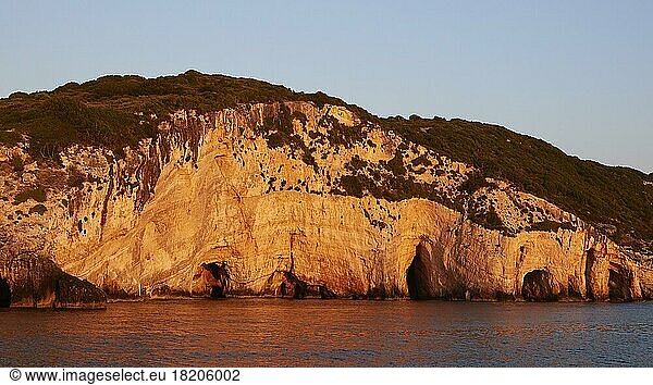 Blue Caves  morning light  rocky coast  northeast coast  blue cloudless sky  Zakynthos Island  Ionian Islands  Greece  Europe